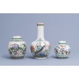 A Chinese bottle shaped Nanking crackle famille verte vase and two warrior jars, 19th/20th C.