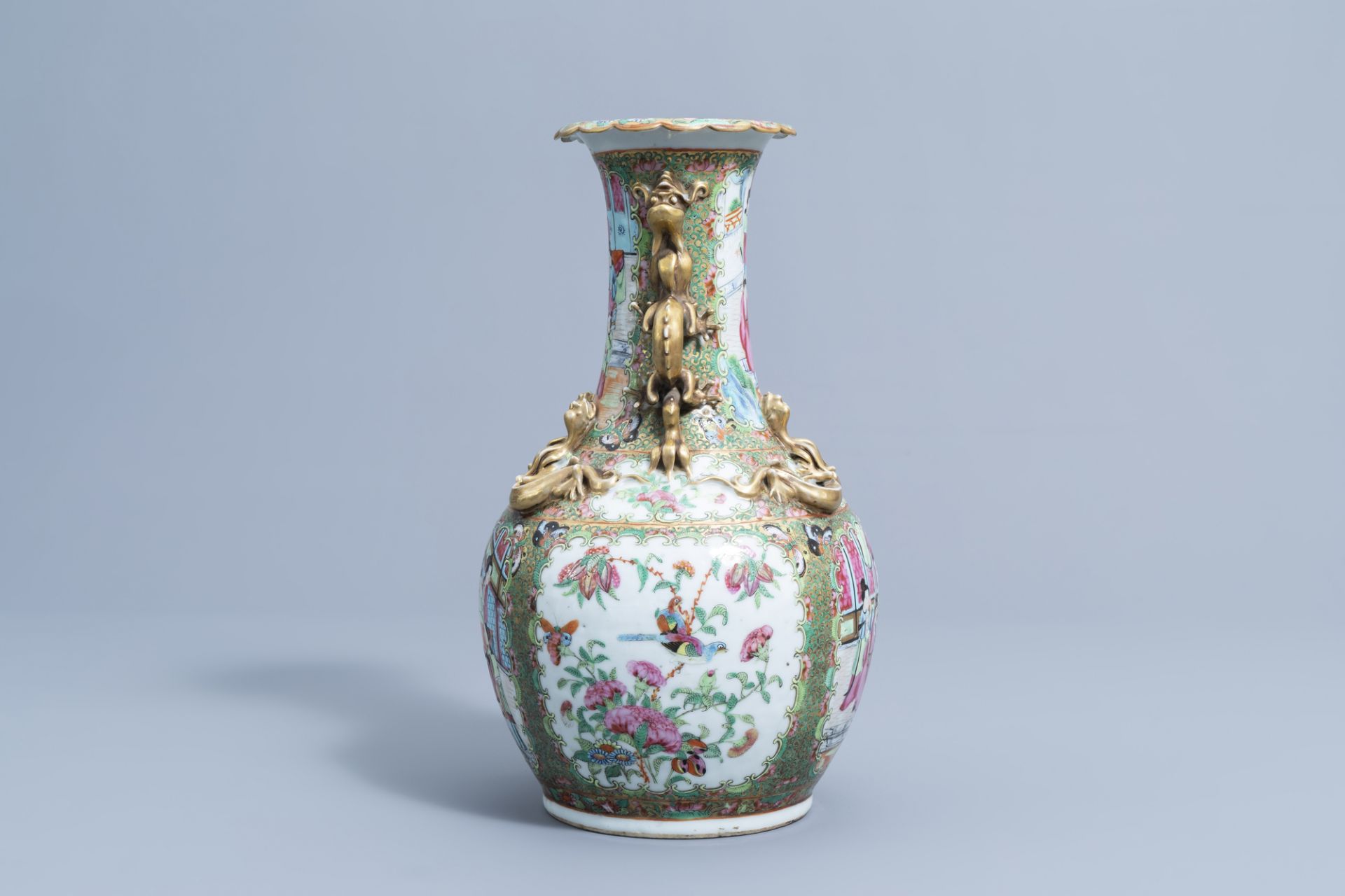 A Chinese Canton famille rose relief decorated 'dragons' bottle vase, 19th C. - Image 2 of 6