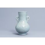 A Japanese celadon glazed 'lotus scroll' bottle vase, Edo/Meiji, 18th/19th C.