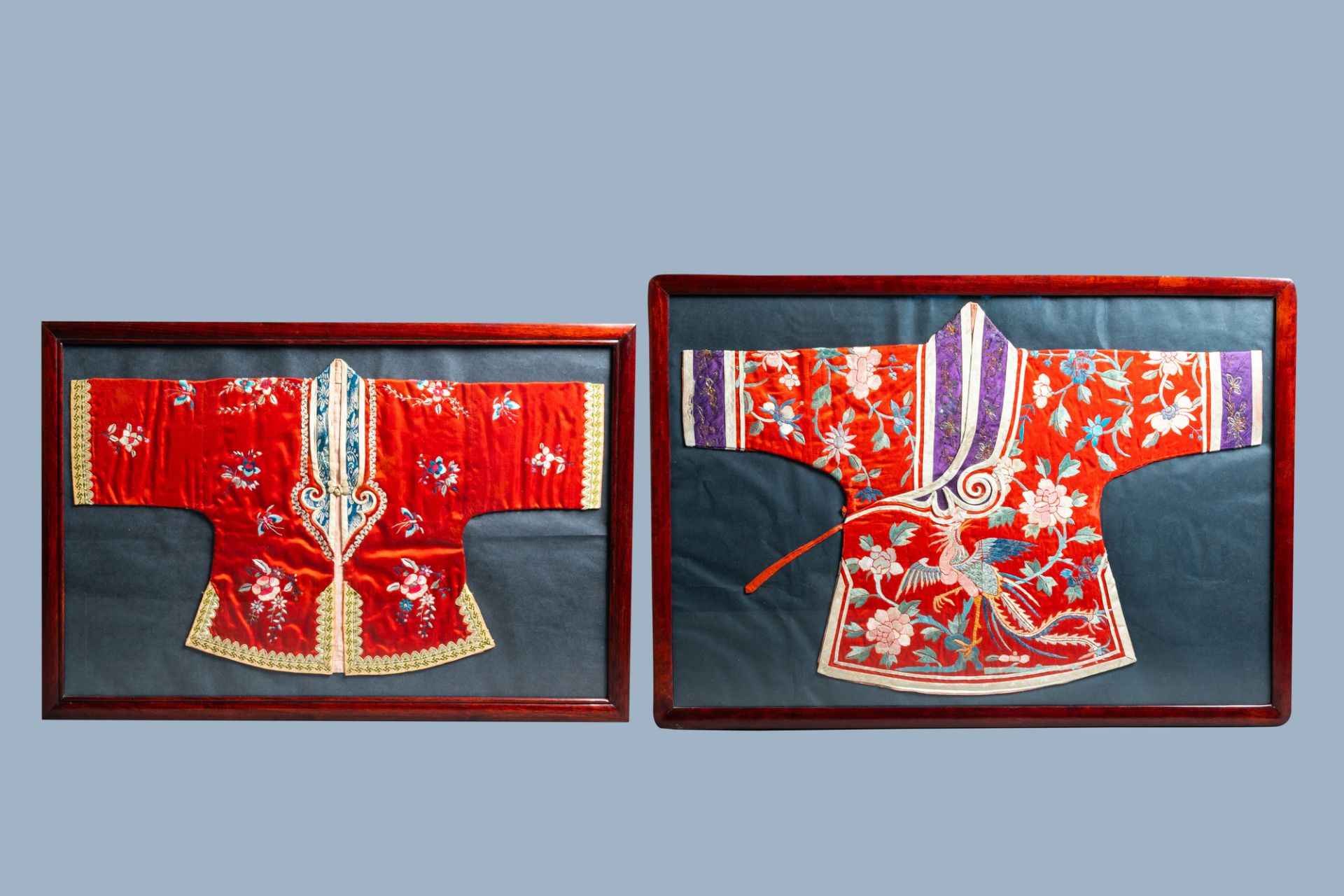 Two framed Chinese embroidered silk children's robes with floral design and animals, 19th/20th C.