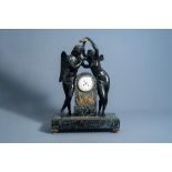 An impressive French patinated and gilt bronze mounted vert de mer marble Empire style mantel clock