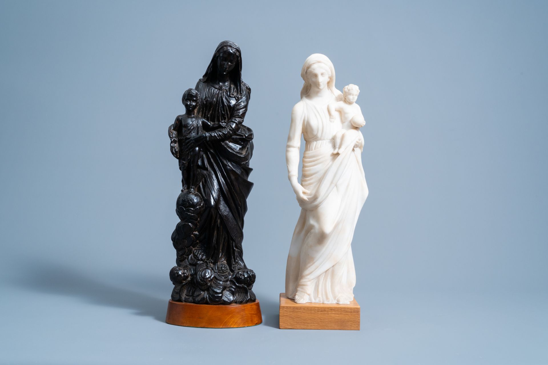 Two Virgin and Child groups in wood and alabaster, one signed K. Van Zundert, 19th/20th C.
