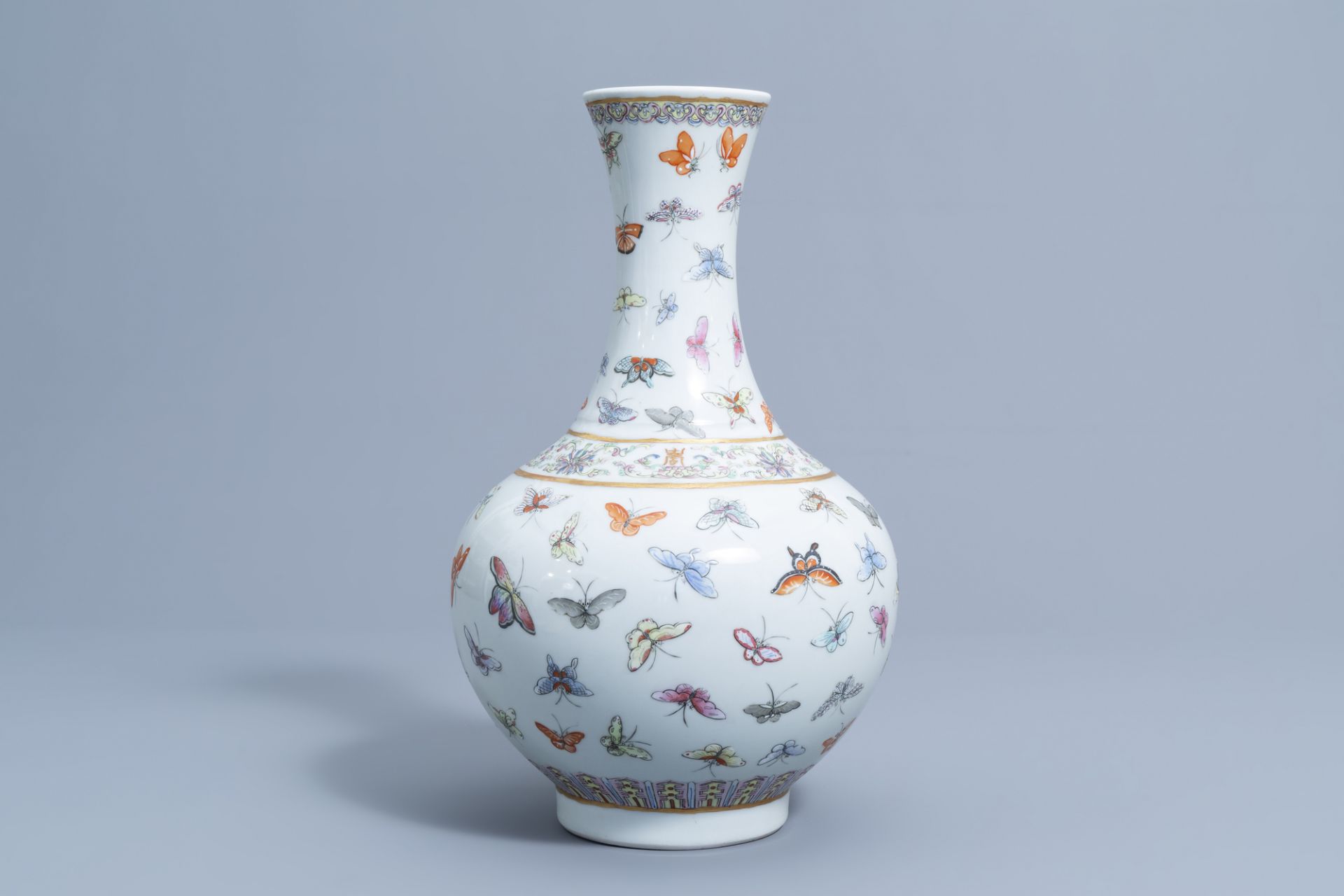 A Chinese famille rose '100 butterflies' bottle vase, Guangxu mark, 20th C. - Image 2 of 7