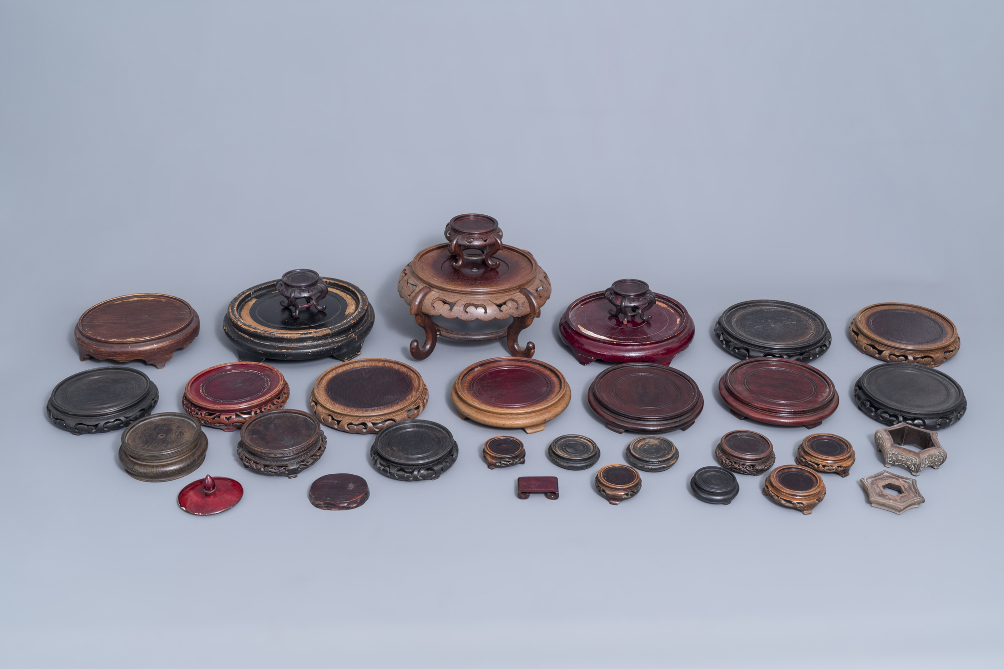 A collection of Chinese wooden stands and a carved wooden stand with marble top, 19th/20th C. - Image 2 of 14