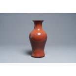 A Chinese monochrome sang de boeuf glazed baluster vase, 19th C.