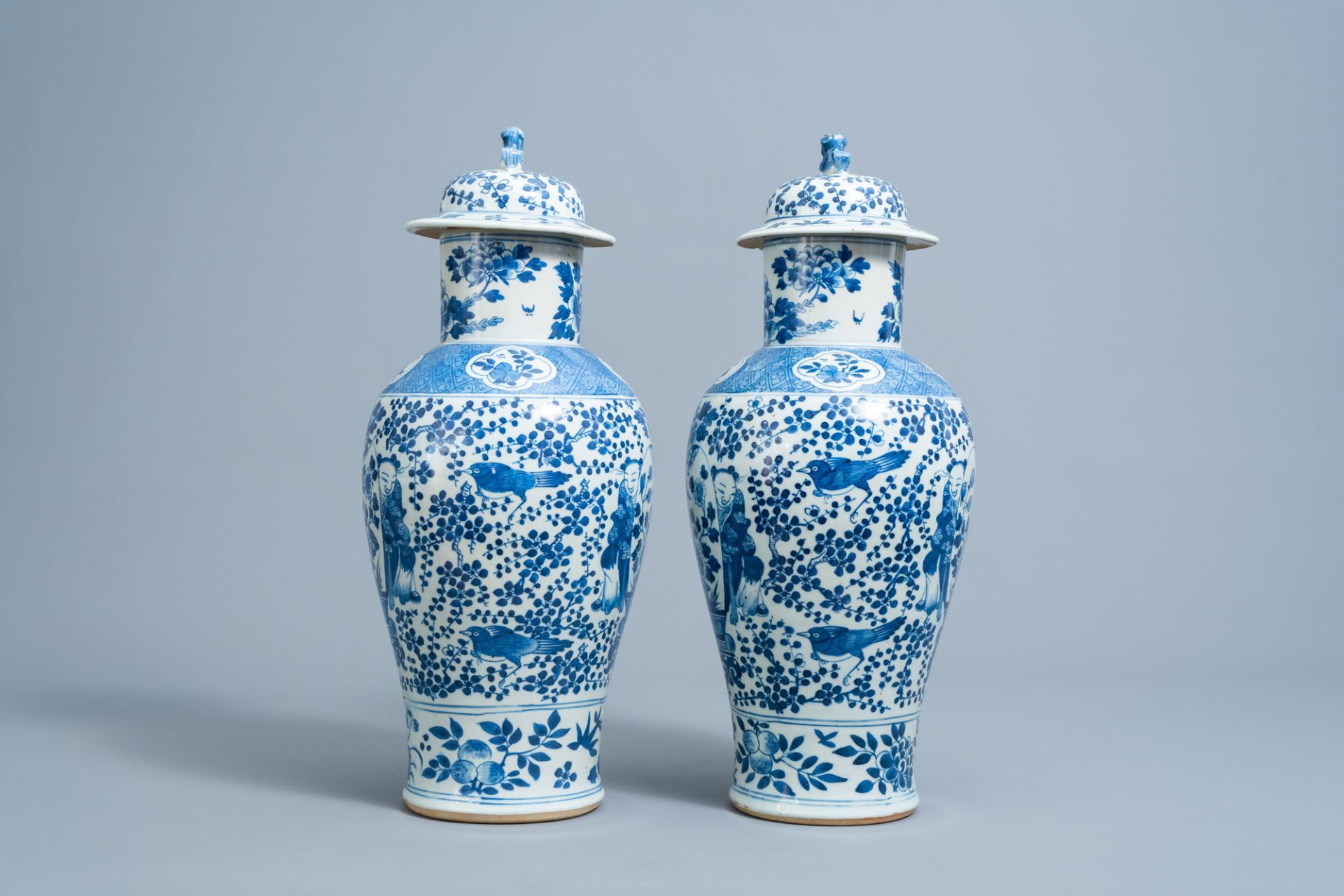 A pair of Chinese blue and white vases and covers with boys and antiquities, 19th C. - Image 4 of 6