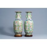 A pair of Chinese Canton famille rose celadon ground vases with court scenes, 19th C.
