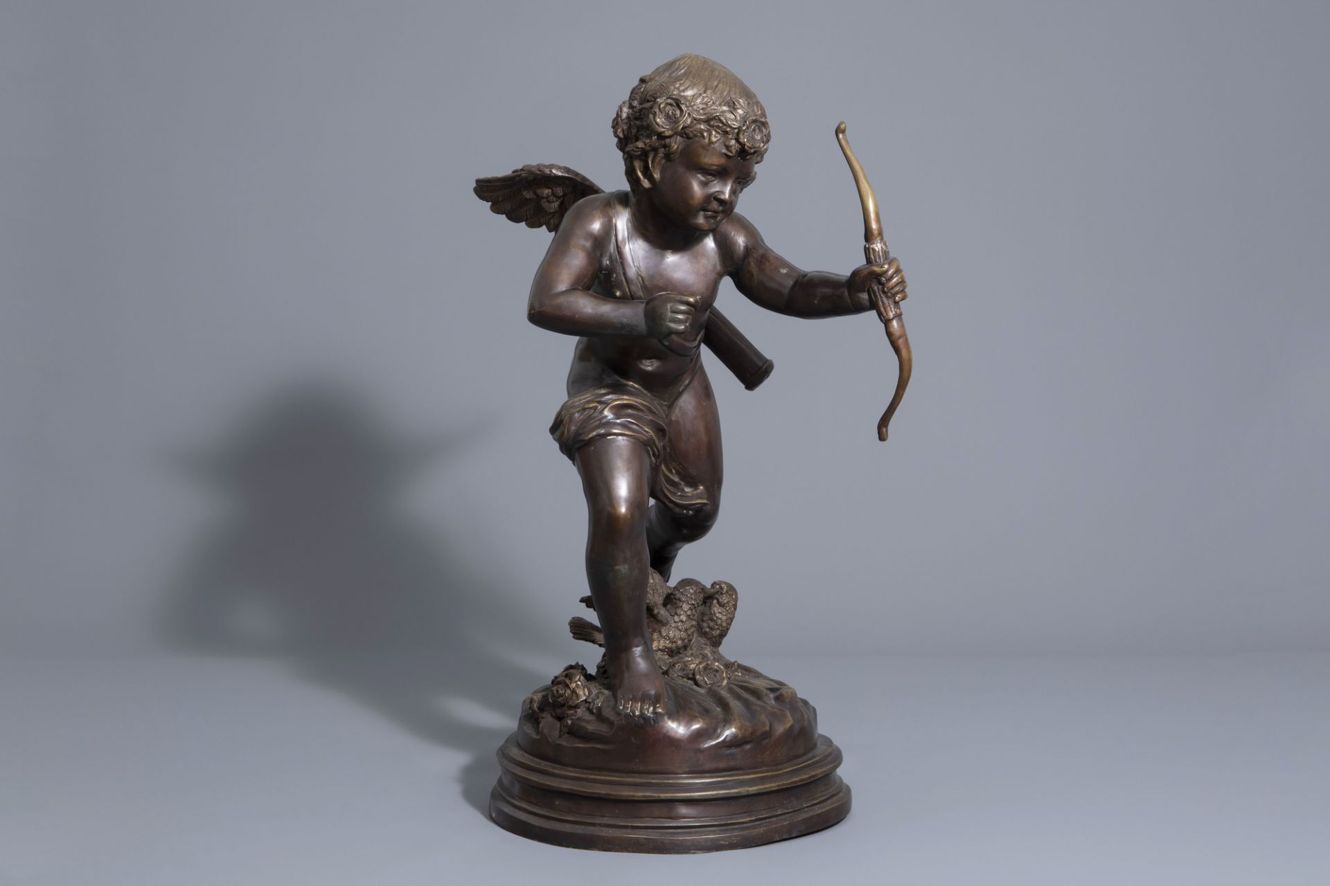 In the manner of Joseph d'Aste (1881-1945): Cupid, patinated bronze