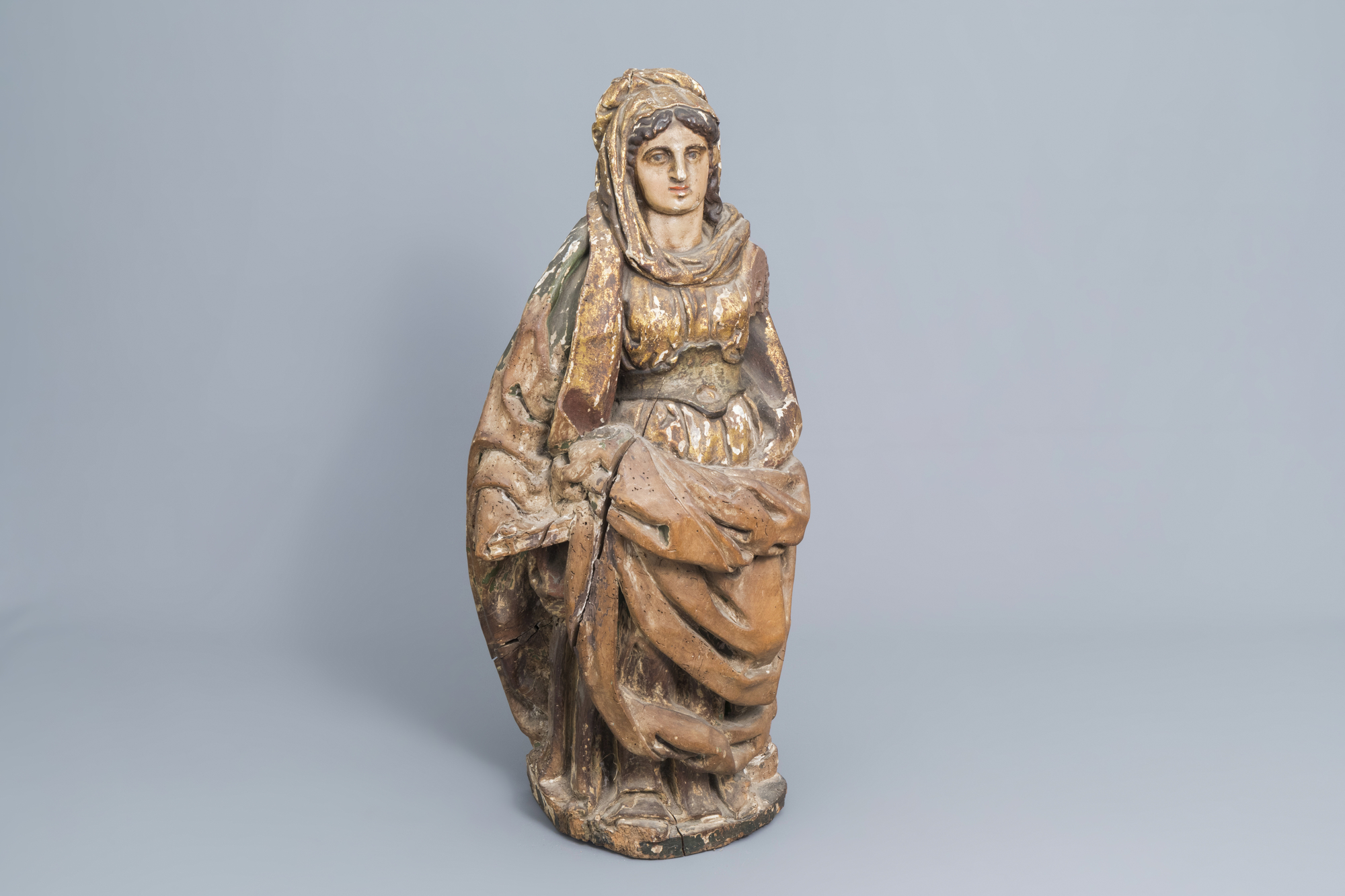 A Southern European carved, gilt and polychrome painted wooden figure, possibly Saint Barbara, 18th