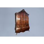 A Dutch veneered wooden two-door cabinet with four drawers, 19th C.