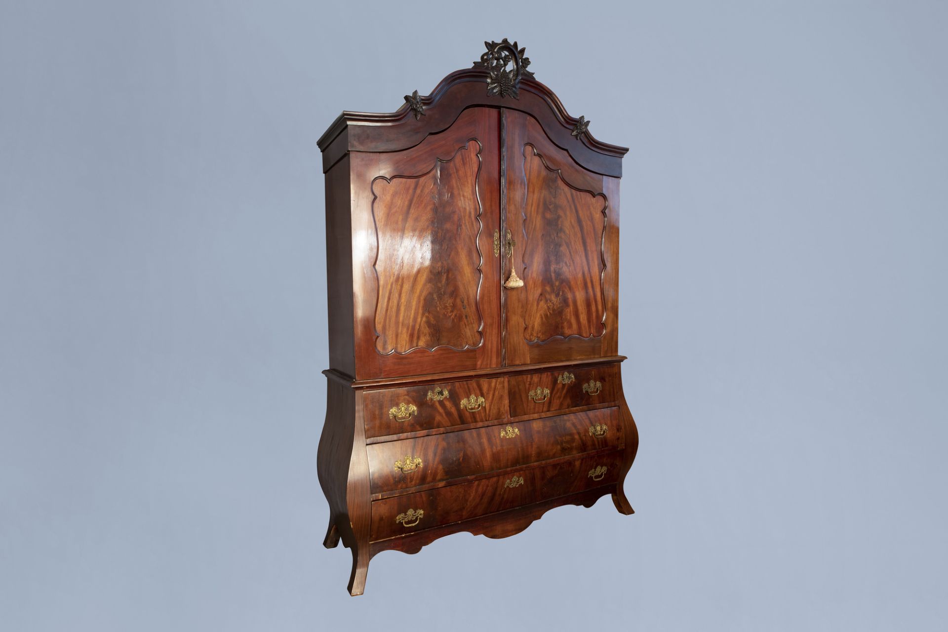 A Dutch veneered wooden two-door cabinet with four drawers, 19th C.