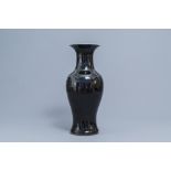 A Chinese monochrome black baluster vase, 19th C.