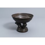 A French bronze and copper bowl resting on three lions, 19th/20th C