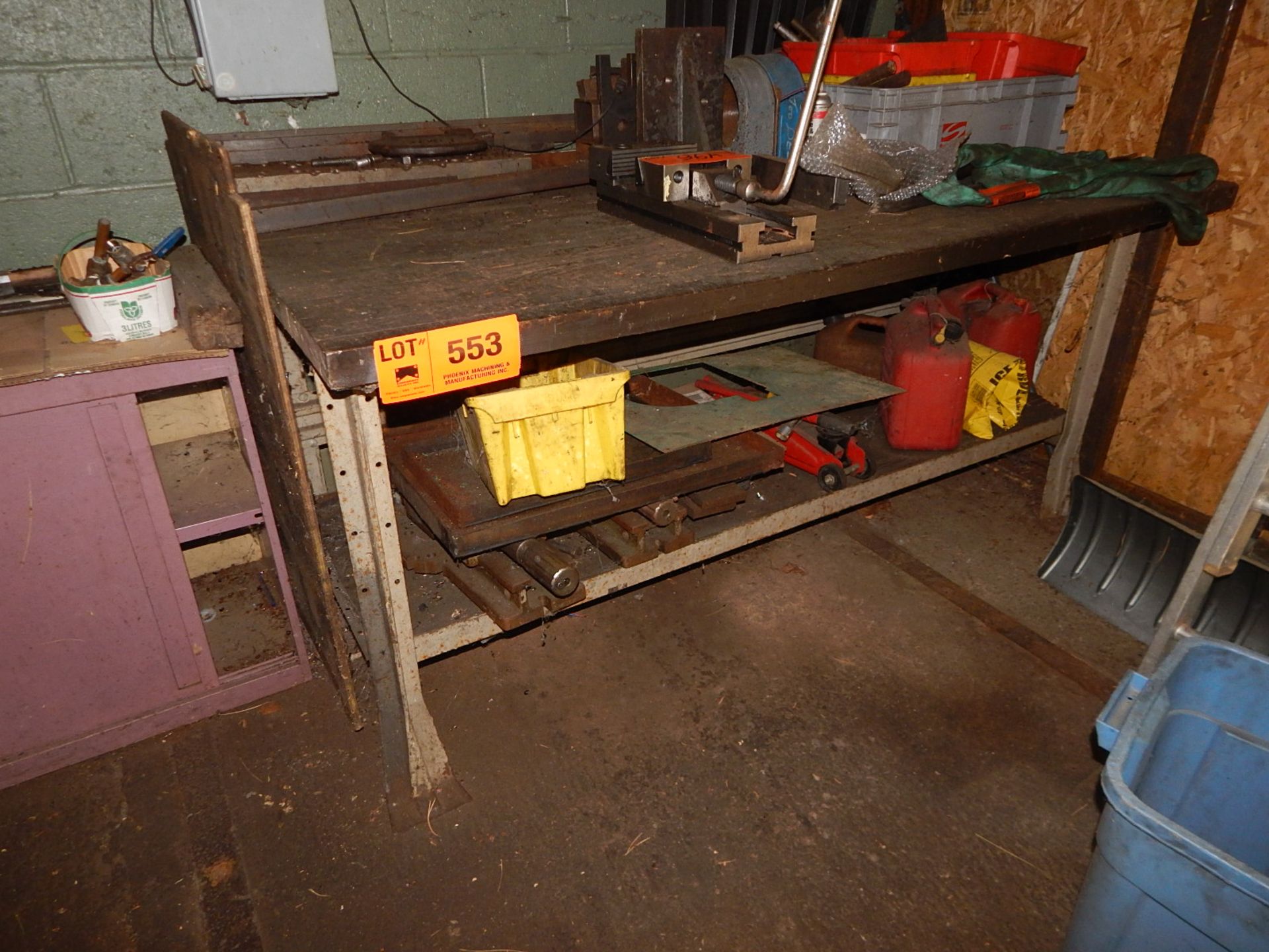 LOT/ WORK BENCH WITH REMAINING CONTENTS - INCLUDING (2) MACHINE VISES, CAR JACK, GAS CANS, SHOP