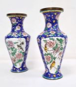 Pair of enamel vases of baluster form painted with panels of birds and foliage, on a blue ground