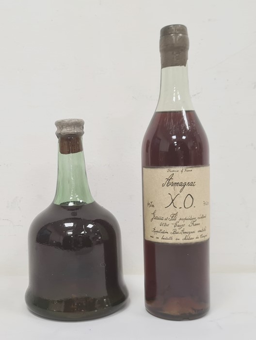 One bottle Chateau du Cariquet Armagnac XO and another bottle, the capsule marked Cognac, E
