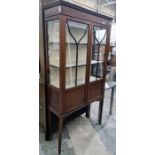 19th century mahogany and satinwood strung display cabinet, the ogee moulded cornice above two