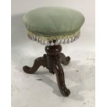 19th century circular stool on baluster turned support to three cabriole legs