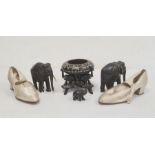 Pair early 20th century lady's satin shoes, ebony elephants and elephant bowl and stand