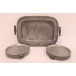 Nineteenth century large pewter hot plate with wooden handles and two antique pewter circular