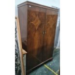 Mid 20th century walnut two-door wardrobe on ogee bracket feet, 115 x 184cm