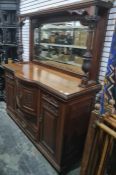 19th century mahogany mirror-back sideboard, the bowed front with assorted cupboard doors and single