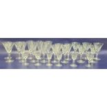 Set of twenty four Waterford cut wine glasses, all with panelled tapering bowls to include flutes
