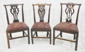 Three Chippendale-style oak dining chairs with pierced vase-shaped backs (3)