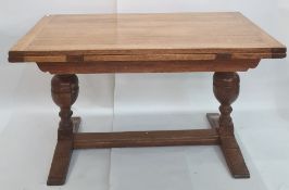 Early 20th century rectangular oak extending dining table with cleated end supports to the top,