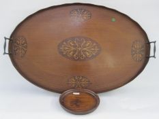 Inlaid mahogany tray with brass scroll handles, serpentine raised edge, five paterae inlaid with