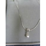 Solitaire diamond drop pendant, claw set in silver mount, on fine chain, the stone approx 0.10ct