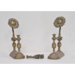 Pair of brass sunflower pattern firedogs, each with spiral turned columns and a pair of Fagin & Bill