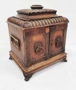 Unusual box / compendium covered in leather, the lid of pagoda form above two doors enclosing