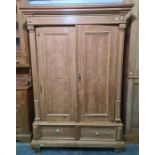 19th century pine wardrobe with cavetto moulded cornice above two panelled single doors, two drawers