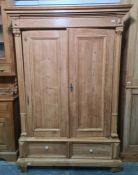 19th century pine wardrobe with cavetto moulded cornice above two panelled single doors, two drawers