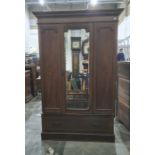 Late 19th/early 20th century single mirrored door wardrobe with cavetto moulded cornice, inlaid