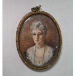 Late 19th/early 20th century school  Watercolour miniature on ivory Head and shoulders portrait of a