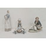 Lladro figure of a girl carrying lamb, 28cm high approx, another of girl seated with duck and
