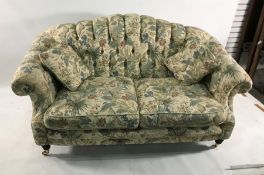 Lincoln House two-seat sofa, two armchairs and pouffe in cream ground foliate patterned