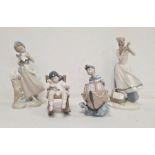 Lladro figure of girl with two doves, another of boy with boat, another of girl with doll in rocking