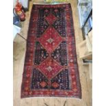 Persian Hamadan village rug, the blue ground with three red ground medallions, the field with