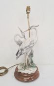Resin and stained wood table lamp in the form of two herons, 55cm high approx