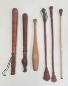 Victorian truncheon, no.3069, another vintage truncheon, a small wooden club and three riding crops