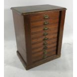19th century Wellington-type collector's cabinet, the stained pine top above nine drawers, on plinth