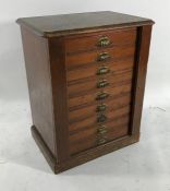 19th century Wellington-type collector's cabinet, the stained pine top above nine drawers, on plinth