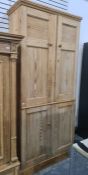 19th century pine cupboard with moulded cornice above two pairs of panelled doors, on plinth base,