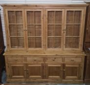 20th century pine dresser, the top with four glazed doors, the base of drawers and cupboard doors,