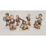 Seven various Hummel figures including boy with telescope, boy with letters and boy with turnips and