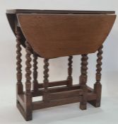 Antique oak gateleg dining table, oval, having single end drawer, on barleytwist turned supports