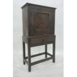 18th century oak livery cupboard, the rectangular top above cupboard door with pierced flowerhead